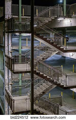 Stock Image - Staircase in parking garage at night. Fotosearch
