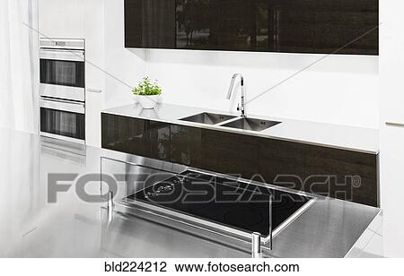 Stock Image - Stove and glass screen in modern kitchen. Fotosearch