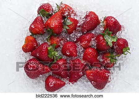 Stock Photograph - Strawberries on ice. Fotosearch