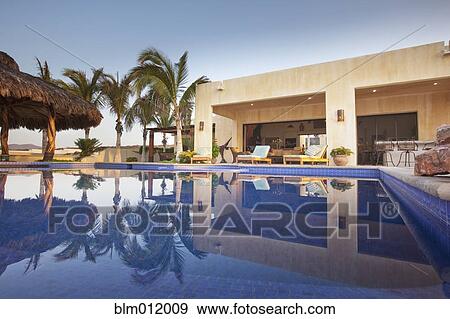 Stock Photo - Swimming pool and elegant patio. Fotosearch