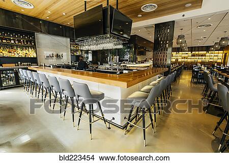 Tables and chairs in modern bar and restaurant View Large Photo Image Picture - Tables and chairs in modern bar and restaurant. Fotosearch