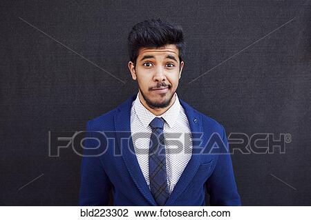 Uncertain Middle Eastern man wearing jacket and tie View Large Photo Image Stock Image - Uncertain Middle Eastern man wearing jacket and tie. Fotosearch