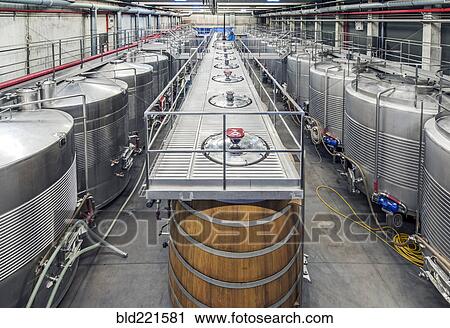 Stock Image - Vats in wine processing plant. Fotosearch