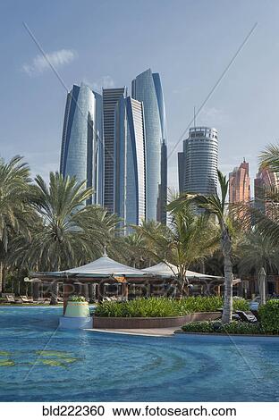 Stock Image - "Waterfront near modern highrises, Abu Dhabi, Abu Dhabi Emirate, United Arab Emirates, ". Fotosearch