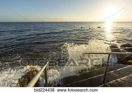 Waves splashing on staircase at ocean View Large Photo Image Stock Photo - Waves splashing on staircase at ocean. Fotosearch