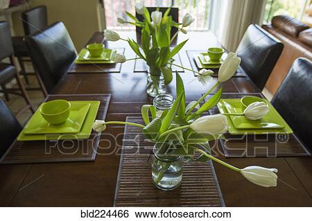 Wilting flowers in jar on dining table View Large Photo Image Stock Photograph - Wilting flowers in jar on dining table. Fotosearch