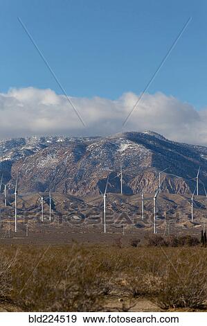Wind turbines near mountain View Large Photo Image Stock Photo - Wind turbines near mountain. Fotosearch