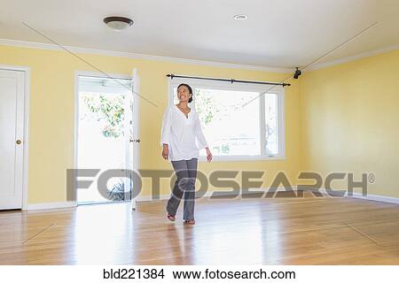 Woman admiring new home View Large Photo Image Picture - Woman admiring new home. Fotosearch