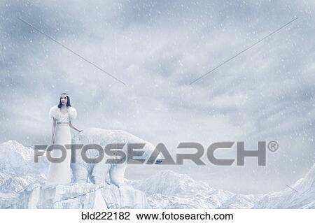 Stock Image - Woman and polar bear standing on glacier. Fotosearch