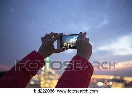 Woman photographing New York cityscape, New York, United States View Large Photo Image Stock Photograph - Woman photographing New York cityscape, New York, United States. Fotosearch