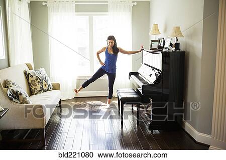 Woman stretching at window View Large Photo Image Stock Image - Woman stretching at window. Fotosearch