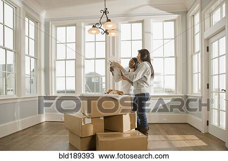 Stock Image - Women planning interior design. Fotosearch