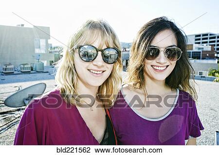 Women smiling on urban rooftop View Large Photo Image Stock Image - Women smiling on urban rooftop. Fotosearch