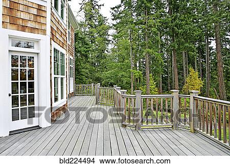 Wooden deck on house near forest View Large Photo Image Picture - Wooden deck on house near forest. Fotosearch