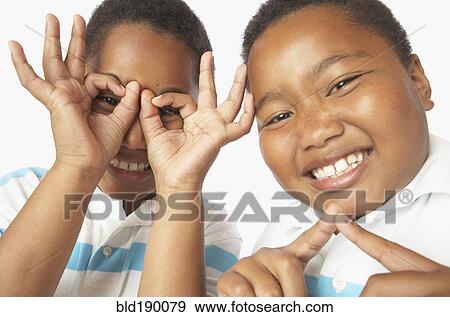 Stock Photo - Young African twin brothers being silly. Fotosearch