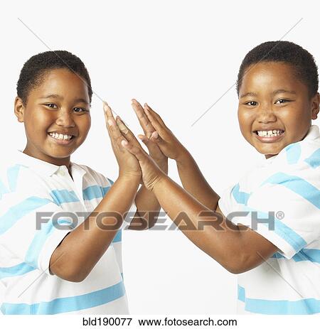Young African twin brothers smiling View Large Photo Image Stock Photo - Young African twin brothers smiling. Fotosearch