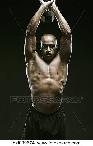 Picture - African American man weight lifting. Fotosearch