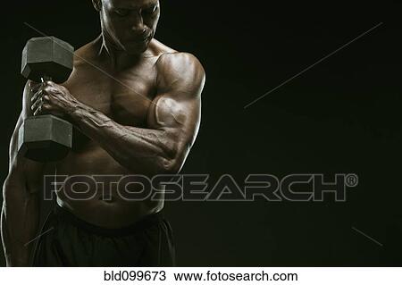 Stock Image - African American man weight lifting. Fotosearch