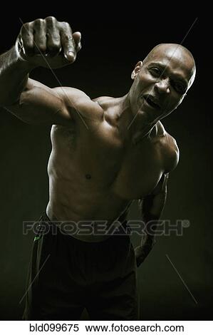 Stock Photography - Aggressive African American athlete. Fotosearch