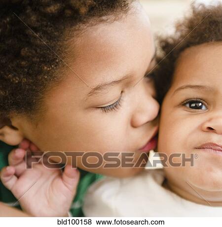 Black boy kissing sister View Large Photo Image Stock Photo - Black boy kissing sister. Fotosearch