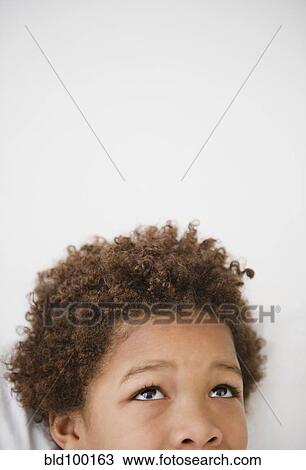 Black boy looking up, View Large Photo Image Stock Image - Black boy looking up, . Fotosearch