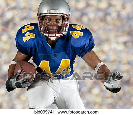 Black football player running with ball View Large Photo Image Stock Image - Black football player running with ball. Fotosearch