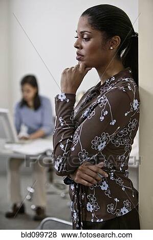 Stock Photo - Businesswoman working in office. Fotosearch