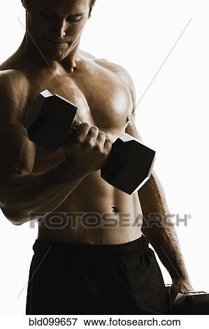 Caucasian man lifting weights View Large Photo Image Stock Photo - Caucasian man lifting weights. Fotosearch