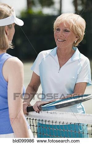 Caucasian women playing tennis View Large Photo Image Stock Photograph - Caucasian women playing tennis. Fotosearch