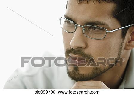Close up of man with beard wearing eyeglasses View Large Photo Image Stock Image - Close up of man with beard wearing eyeglasses. Fotosearch