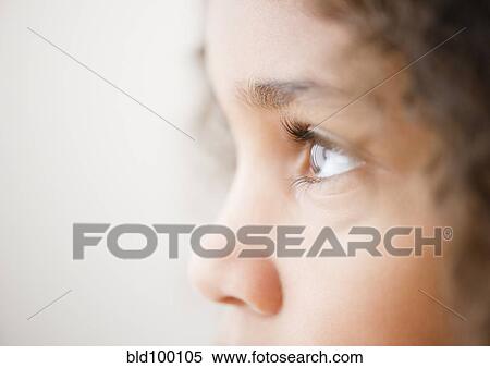 Stock Photography - Close up of mixed race girl's face. Fotosearch