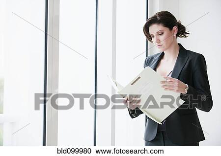 Cuban businesswoman looking at report View Large Photo Image Stock Image - Cuban businesswoman looking at report. Fotosearch