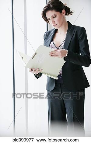 Cuban businesswoman looking at report View Large Photo Image Stock Photo - Cuban businesswoman looking at report. Fotosearch