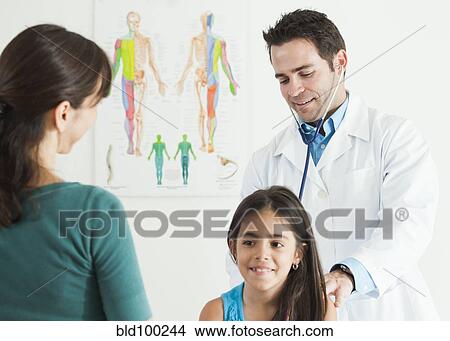 Doctor examining girl as mother watches View Large Photo Image Picture - Doctor examining girl as mother watches. Fotosearch