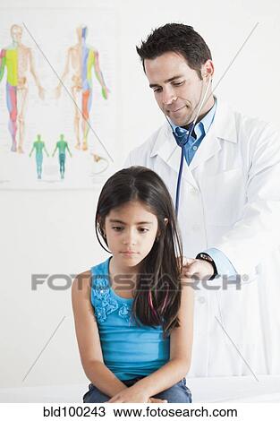 Doctor examining girl View Large Photo Image Stock Image - Doctor examining girl. Fotosearch