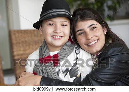 Hispanic mother hugging son View Large Photo Image Stock Image - Hispanic mother hugging son. Fotosearch