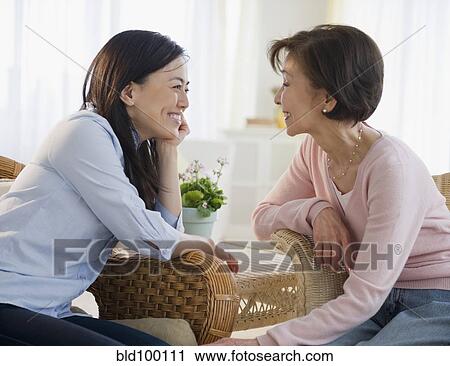 Stock Image - Japanese mother and child talking. Fotosearch