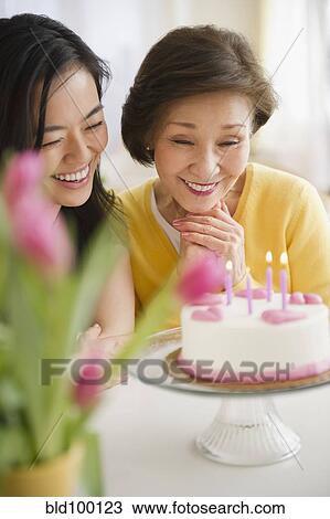 Japanese mother and daughter looking at birthday cake View Large Photo Image Stock Image - Japanese mother and daughter looking at birthday cake. Fotosearch