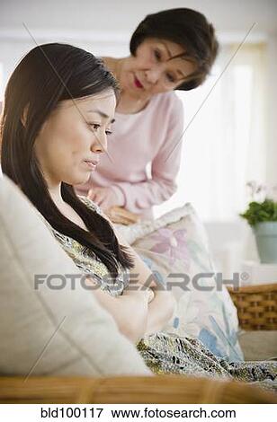 Stock Photo - Japanese mother worrying about daughter. Fotosearch