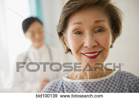 Stock Photo - Japanese woman in doctor's office. Fotosearch