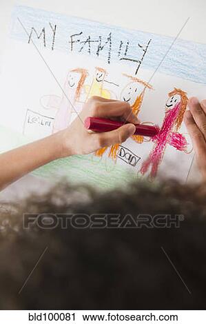 Stock Image - Mixed race girl drawing picture of family. Fotosearch
