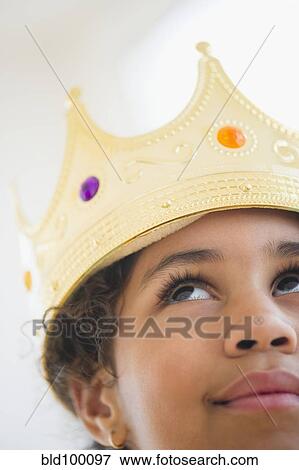Stock Photo - Mixed race girl wearing crown. Fotosearch