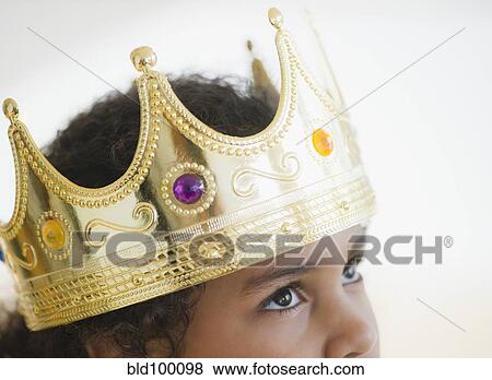 Stock Photo - Mixed race girl wearing crown. Fotosearch