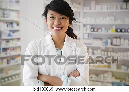 Pacific Islander pharmacist standing in pharmacy View Large Photo Image Stock Photo - Pacific Islander pharmacist standing in pharmacy. Fotosearch