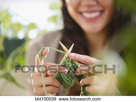 Stock Photo - Pacific Islander woman knitting. Fotosearch