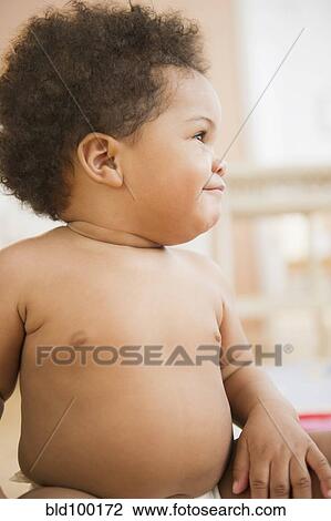 Stock Image - Smiling Black baby girl. Fotosearch