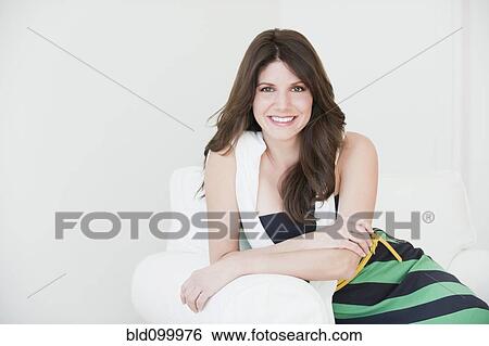 Smiling Cuban woman sitting in chair View Large Photo Image Stock Photograph - Smiling Cuban woman sitting in chair. Fotosearch
