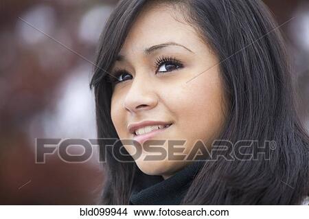 Picture - Smiling Hispanic teenage girl. Fotosearch