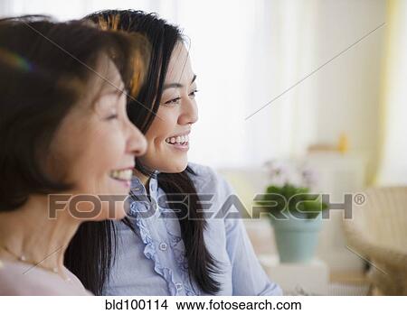 Picture - Smiling Japanese mother and daughter. Fotosearch