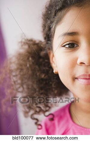 Stock Photo - Smiling mixed race girl. Fotosearch